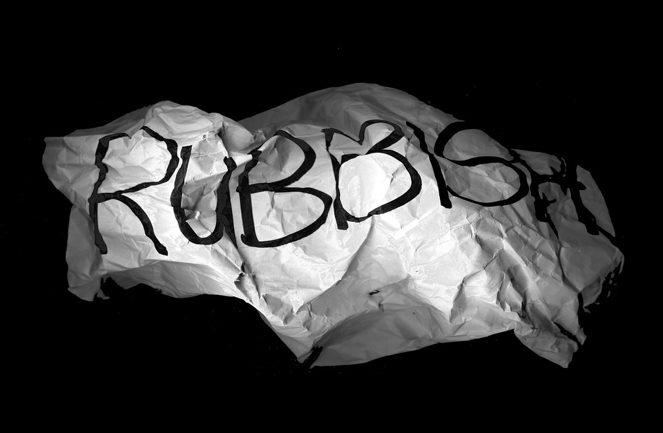 crumpled paper with the word rubbish